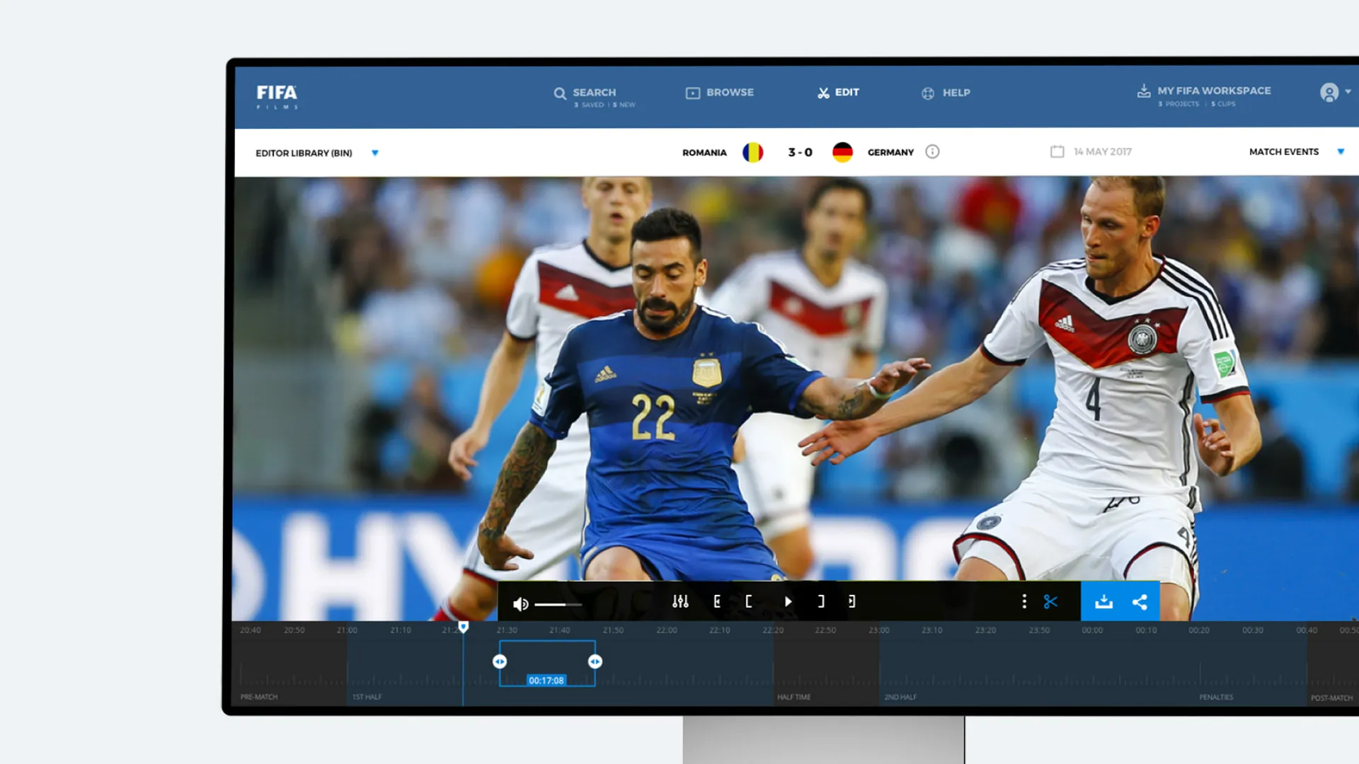 The FIFA archive web app on a monitor, editing a match clip with in and out points on a timeline split into halves, extra time and penalties